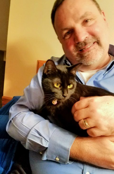 Shy black cat heals grieving military family