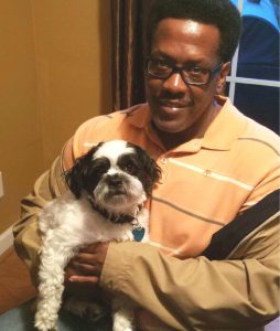 Retired sailor smitten with Snoopy the spotted shelter dog