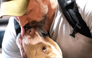 Multi-tour combat veteran and amputee rescues disfigured bait dog who was left for dead